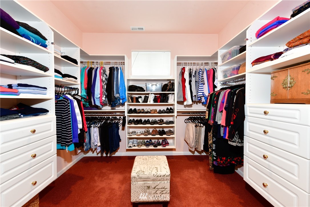 4203 Mitchell Drive Anacortes, WA 98221 - Photo 15 of 38 a view of walk in closet with clothes and shoes