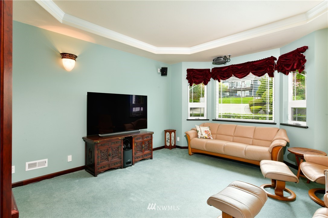 4203 Mitchell Drive Anacortes, WA 98221 - Photo 17 of 38 a living room with furniture and a flat screen tv