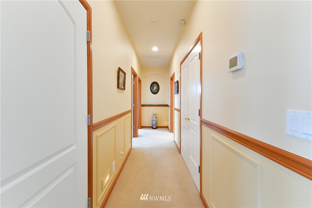 4203 Mitchell Drive Anacortes, WA 98221 - Photo 18 of 38 a view of a hallway with a white door
