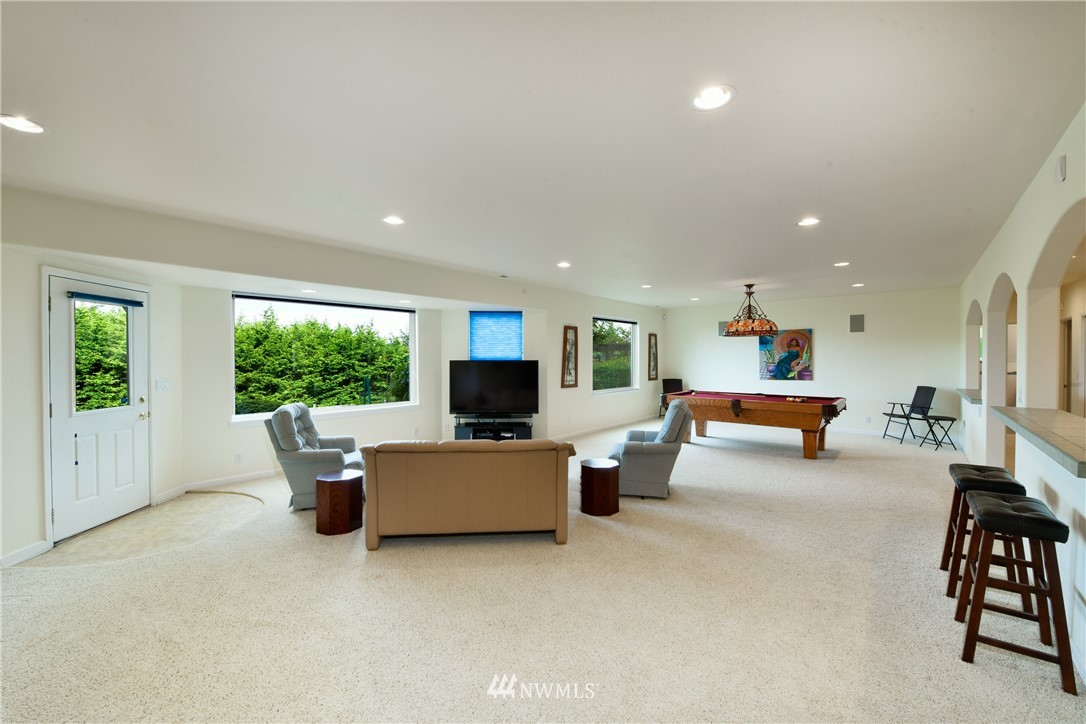 4203 Mitchell Drive Anacortes, WA 98221 - Photo 20 of 38 a living room with furniture and a flat screen tv