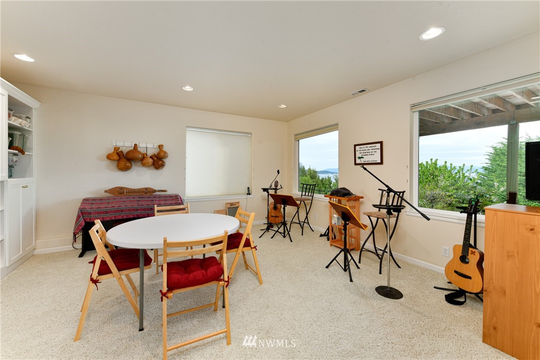 4203 Mitchell Drive Anacortes, WA 98221 - Photo 22 of 38 a view of a dining room with furniture window and outside view