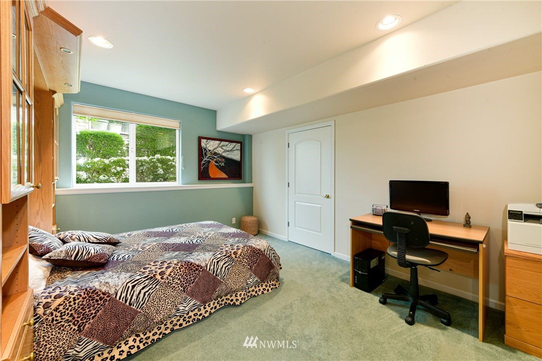 4203 Mitchell Drive Anacortes, WA 98221 - Photo 25 of 38 a bedroom with a bed and a window