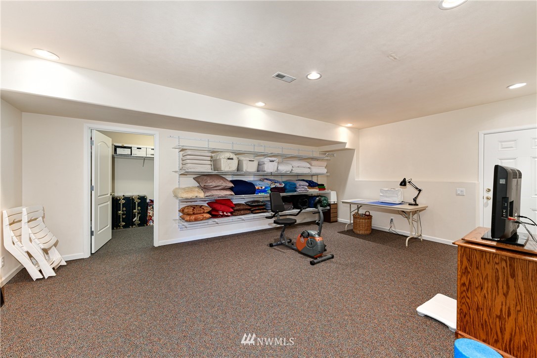 4203 Mitchell Drive Anacortes, WA 98221 - Photo 26 of 38 a living room with furniture and a flat screen tv