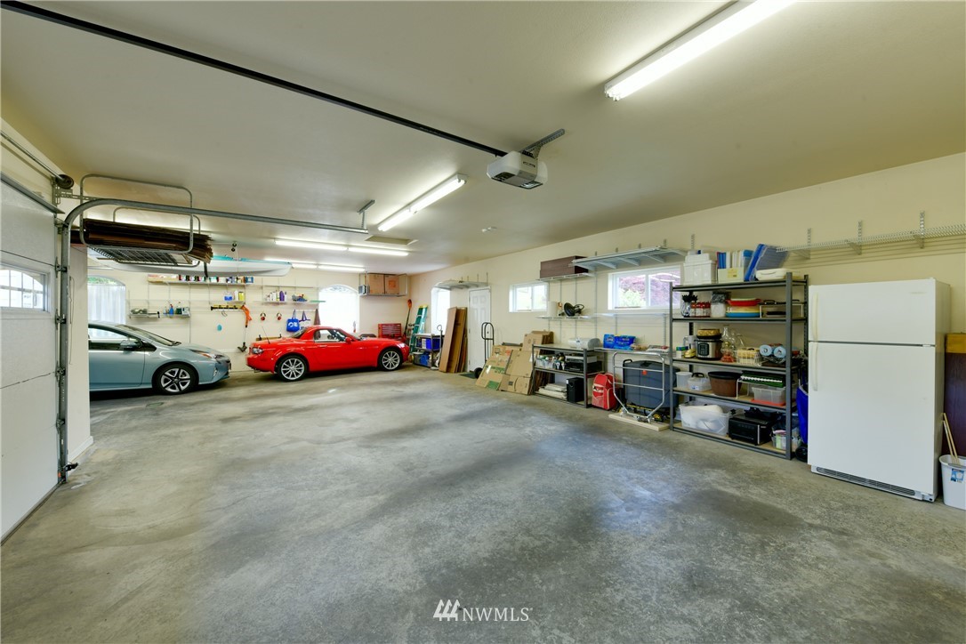 4203 Mitchell Drive Anacortes, WA 98221 - Photo 30 of 38 a view of cars parked in a garage