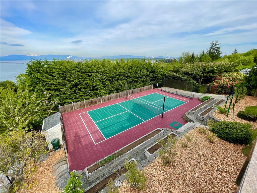 4203 Mitchell Drive Anacortes, WA 98221 - Photo 32 of 38 a view of a tennis ground with large trees