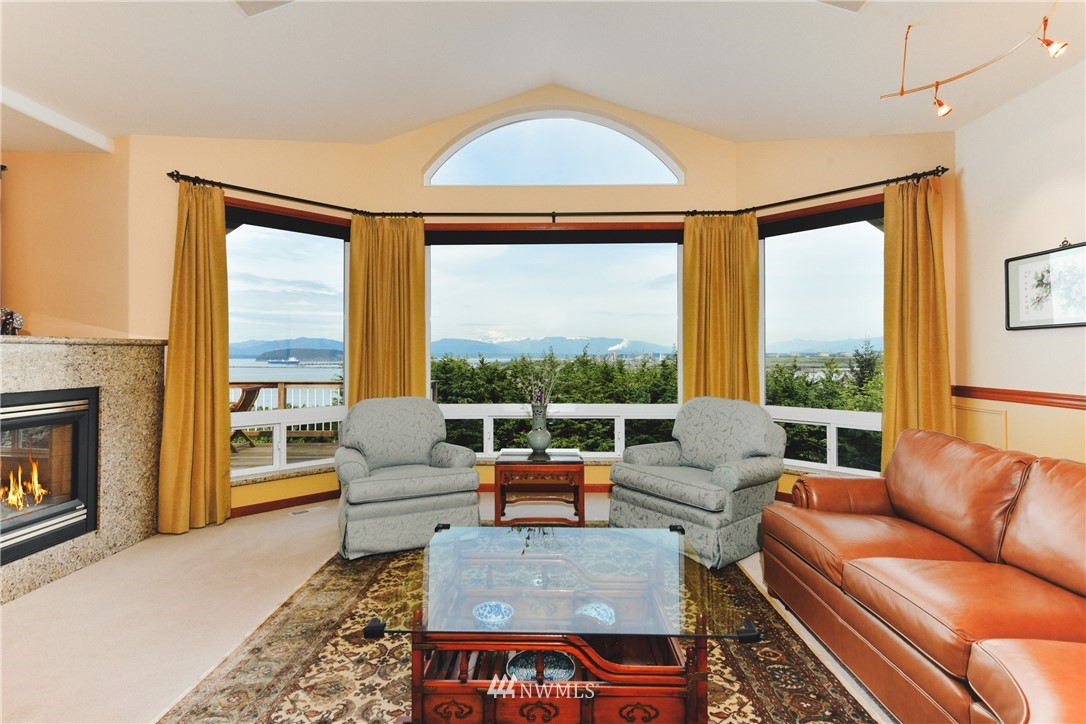4203 Mitchell Drive Anacortes, WA 98221 - Photo 6 of 38 a living room with furniture and a fireplace