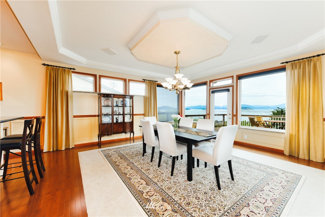 4203 Mitchell Drive Anacortes, WA 98221 - Photo 8 of 38 a view of a dining room with furniture window and wooden floor