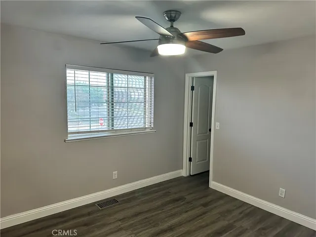 a bathroom with a shower and a toilet