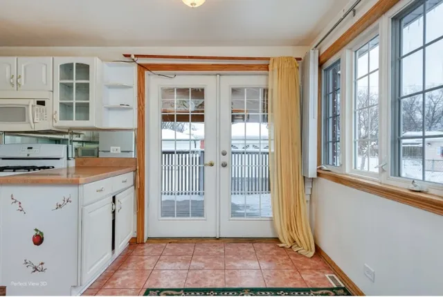 a kitchen with granite countertop a sink and cabinets