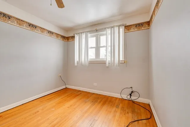 a balcony with table and chairs