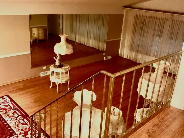 a view of a bathroom with a shower and a bathtub