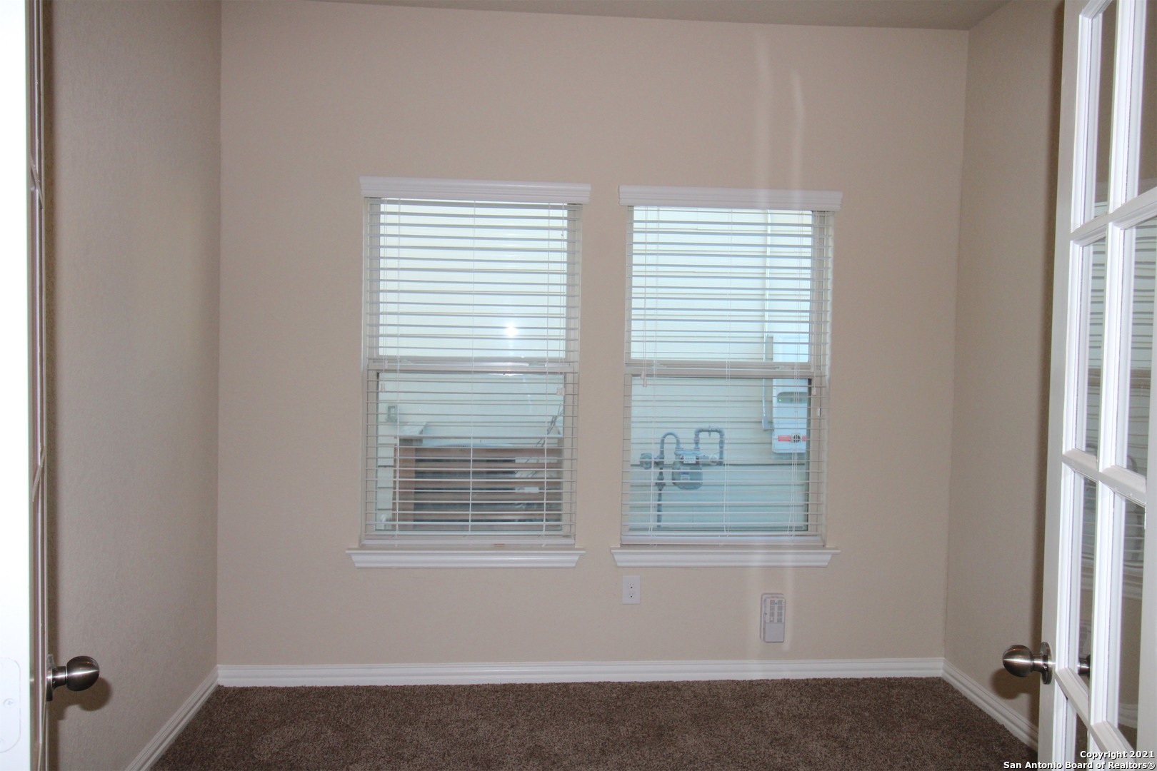 9118 Hogarten Converse, TX 78109 - Photo 8 of 26 a view of an empty room with a window