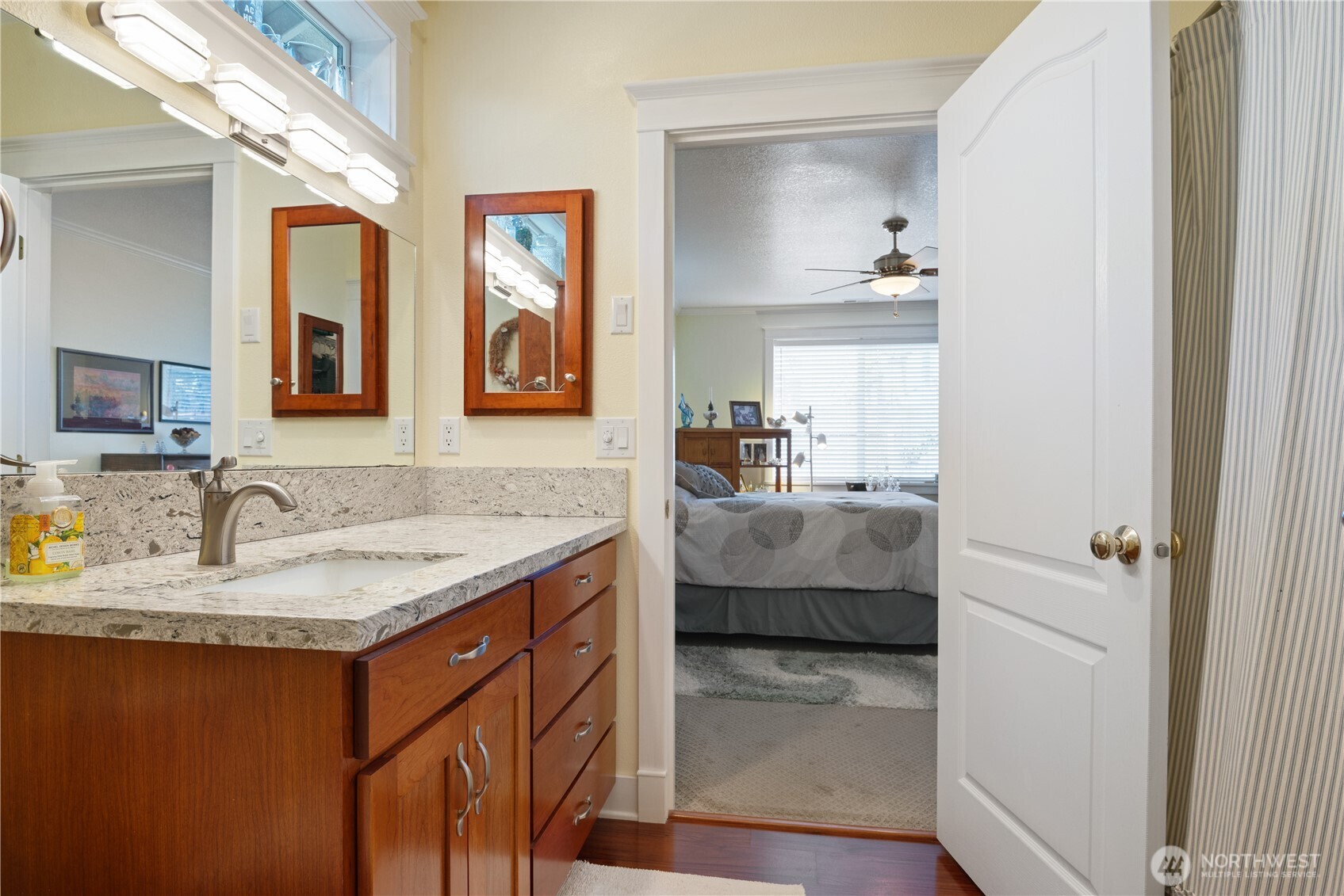 5562 Solo Point Drive Longview, WA 98632 - Photo 18 of 37 a en suite bathroom with a granite countertop sink and a mirror