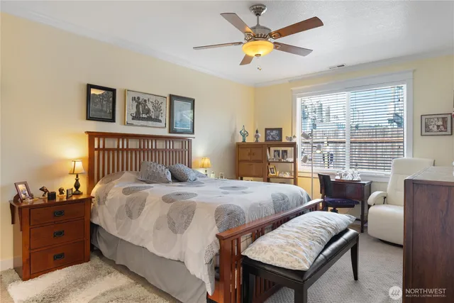 a bedroom with a bed and a table