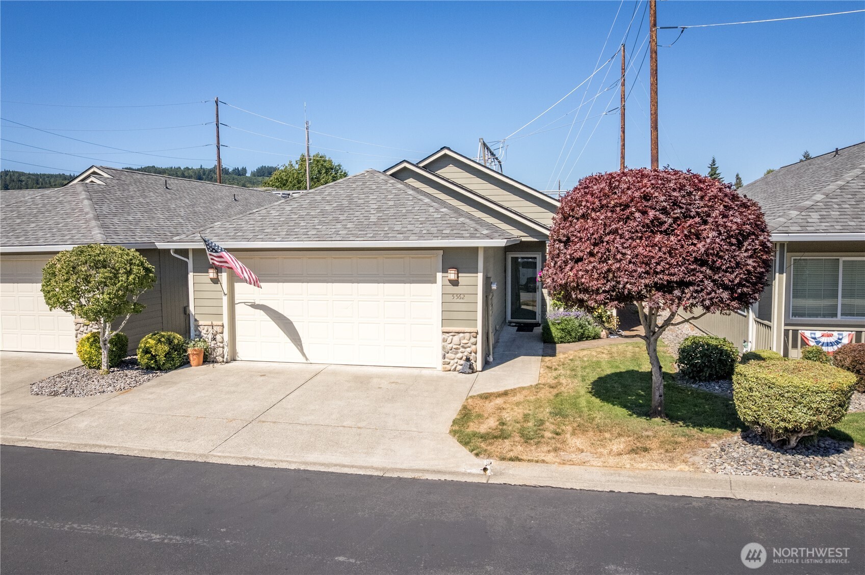 5562 Solo Point Drive Longview, WA 98632 - Photo 3 of 37 a front view of a house with a garage