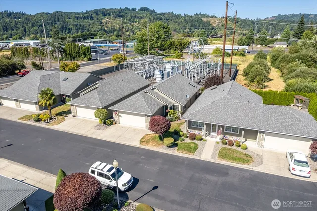 an aerial view of a house with a swimming pool