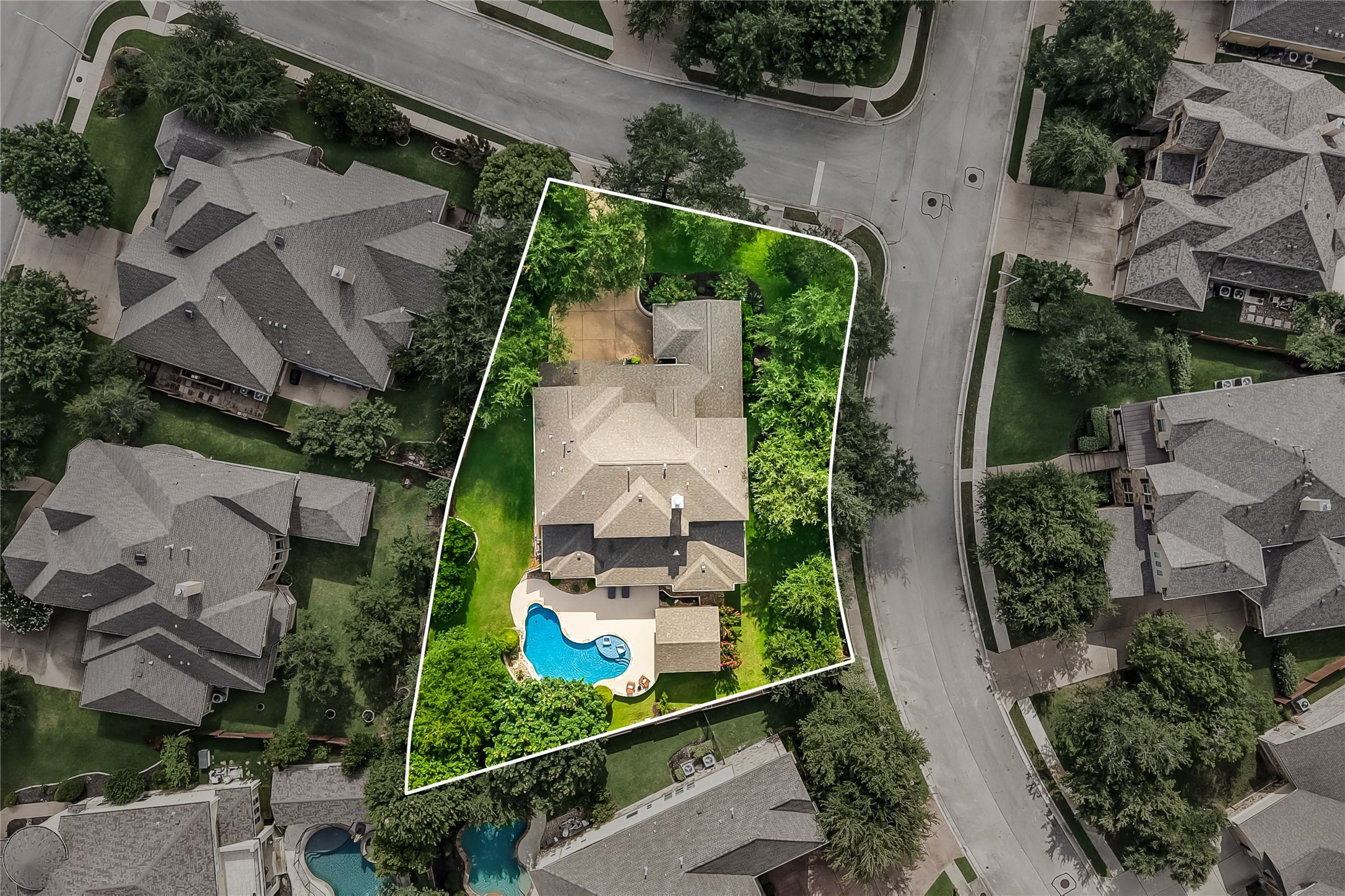 401 Bluff View Road Cedar Park, TX 78613 - Photo 39 of 40 An aerial perspective reveals a private pool with ample surrounding green space, offering a serene backyard escape.
