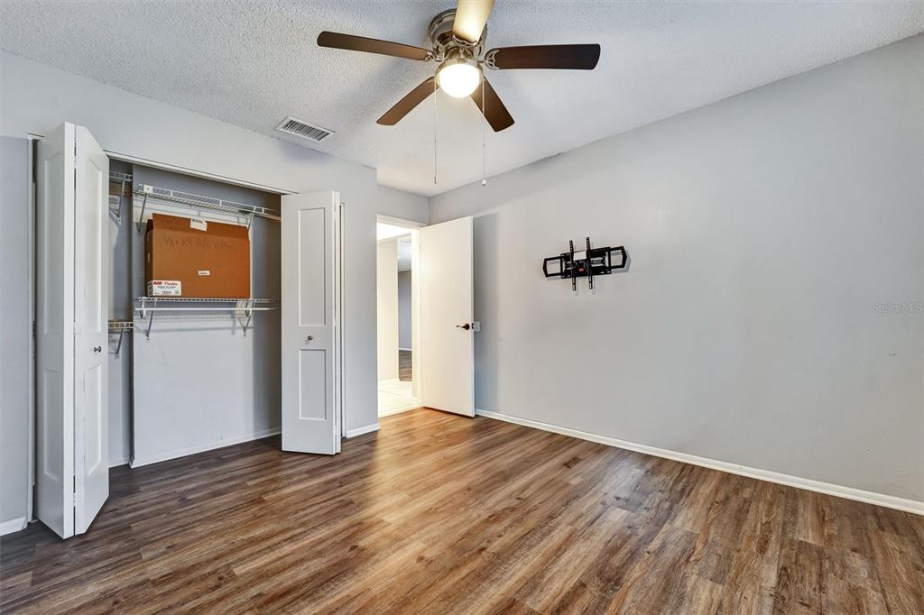 8330 High Point Circle, Unit 6 Port Richey, FL 34668 - Photo 17 of 28 wooden floor in an empty room with a window