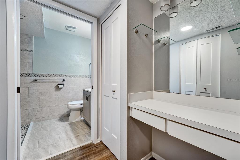 8330 High Point Circle, Unit 6 Port Richey, FL 34668 - Photo 21 of 28 a bathroom with a sink a toilet and shower
