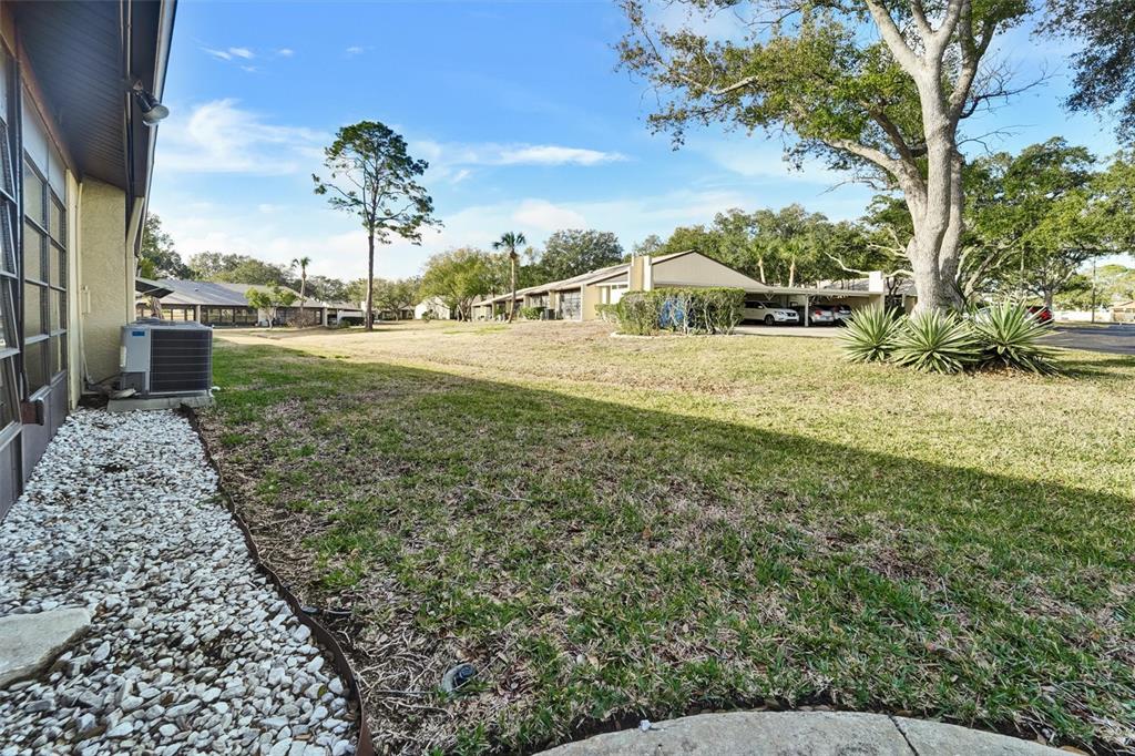 8330 High Point Circle, Unit 6 Port Richey, FL 34668 - Photo 24 of 28 a view of a garden