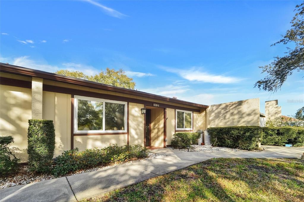 8330 High Point Circle, Unit 6 Port Richey, FL 34668 - Photo 5 of 28 a view of a house with backyard and sitting area