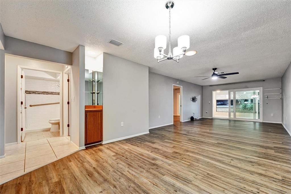 8330 High Point Circle, Unit 6 Port Richey, FL 34668 - Photo 10 of 28 a view of an empty room with window and wooden floor