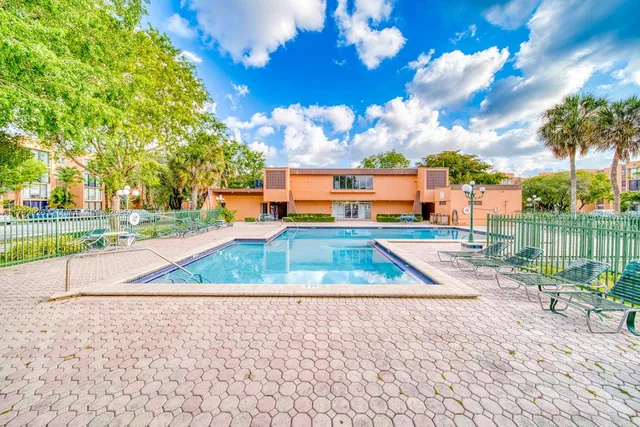 a view of a city street with cars