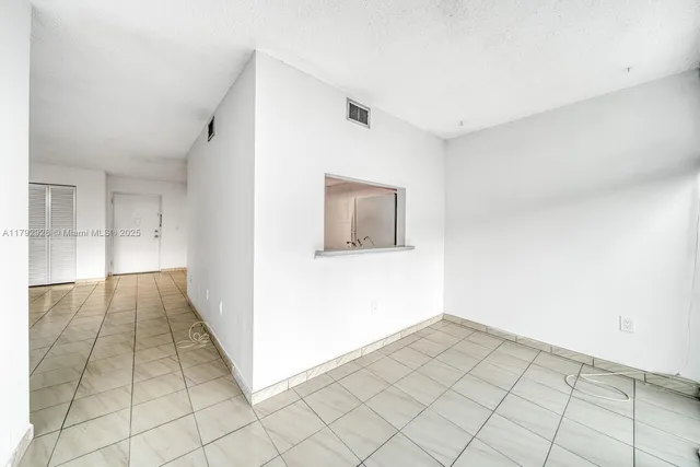 a view of an empty room and window