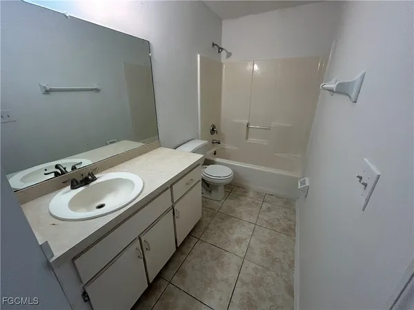 a kitchen with a sink stove and refrigerator