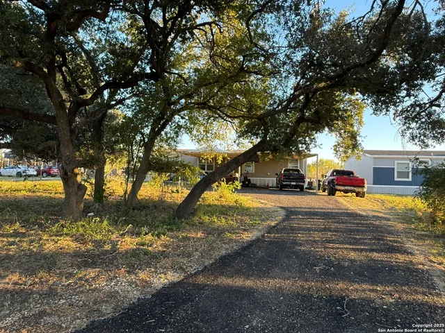a house with trees in front of it