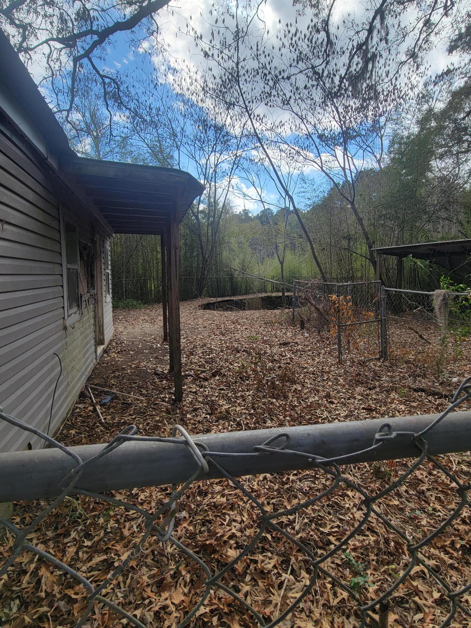 228 Double Bridge Road Laurel Hill, FL 32567 - Photo 14 of 23 a view of a backyard of the house