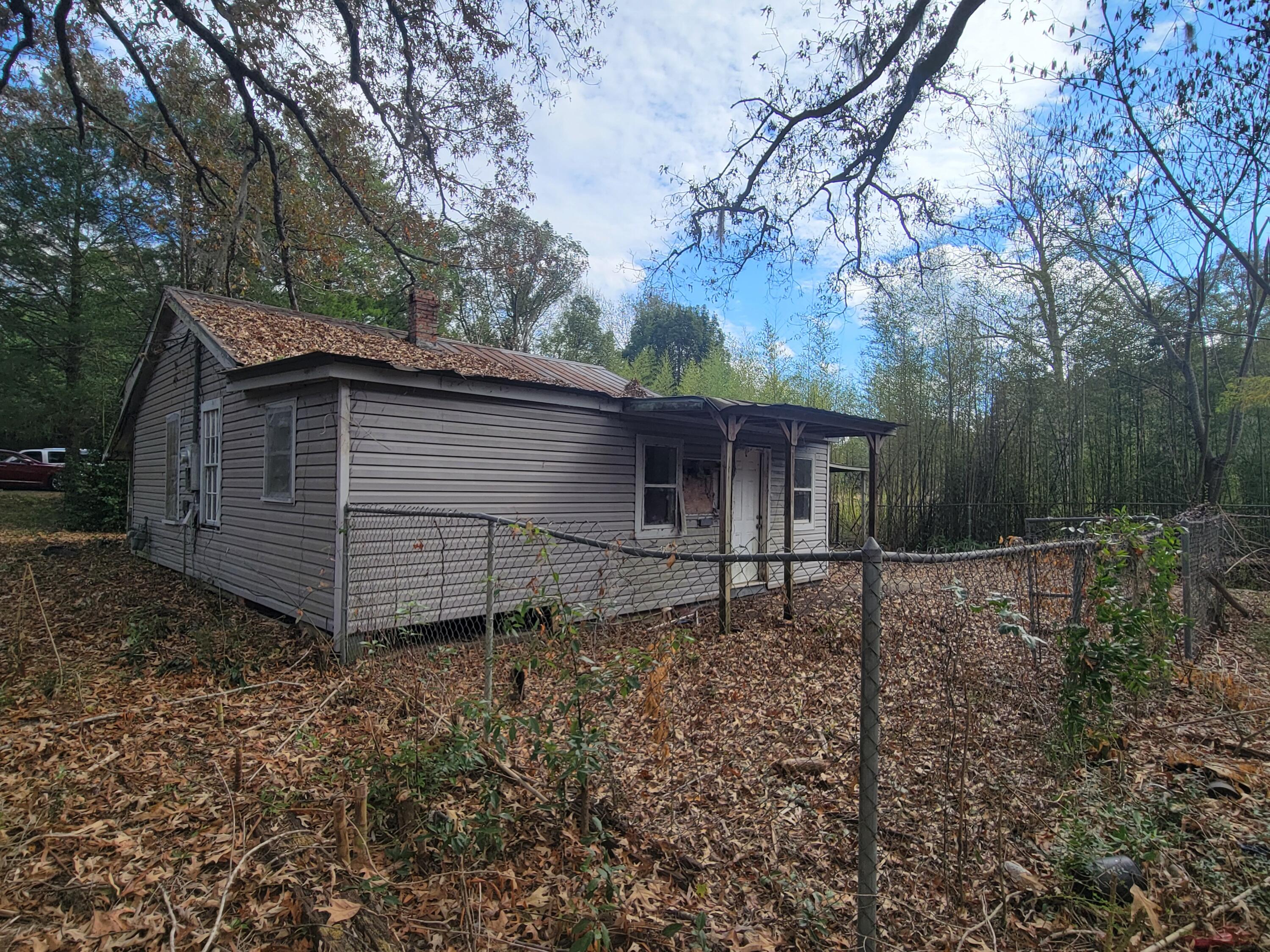 228 Double Bridge Road Laurel Hill, FL 32567 - Photo 2 of 23 a backyard of a house with lots of green space