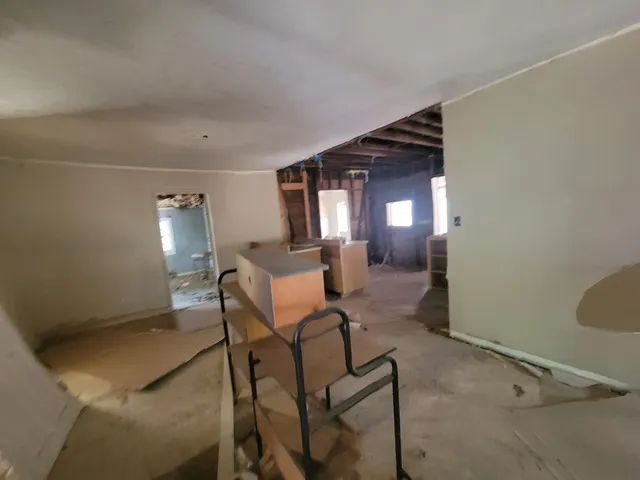 a view of a livingroom with furniture and a window