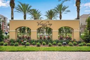 a couple of palm trees in front of house