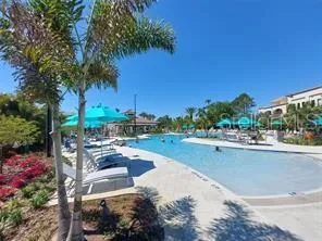a view of a swimming pool with a patio