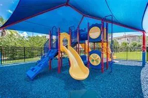 a view of a wooden deck with a backyard