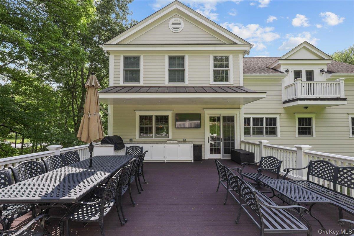 135 Pines Bridge Road Katonah, NY 10536 - Photo 38 of 40 a view of a house with a bed and glass door