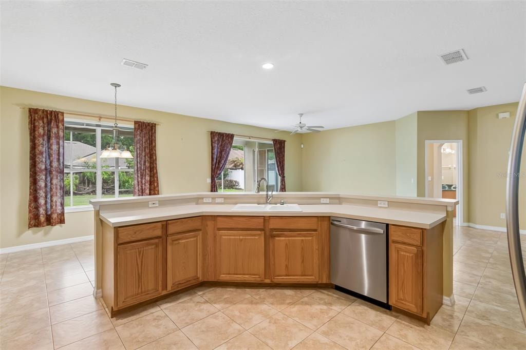10118 Shortwood Lane Orlando, FL 32836 - Photo 14 of 53 a kitchen with a sink and cabinets