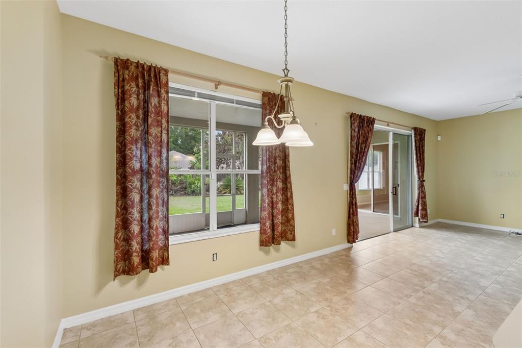 10118 Shortwood Lane Orlando, FL 32836 - Photo 17 of 53 a view of a room with a large window and chandelier