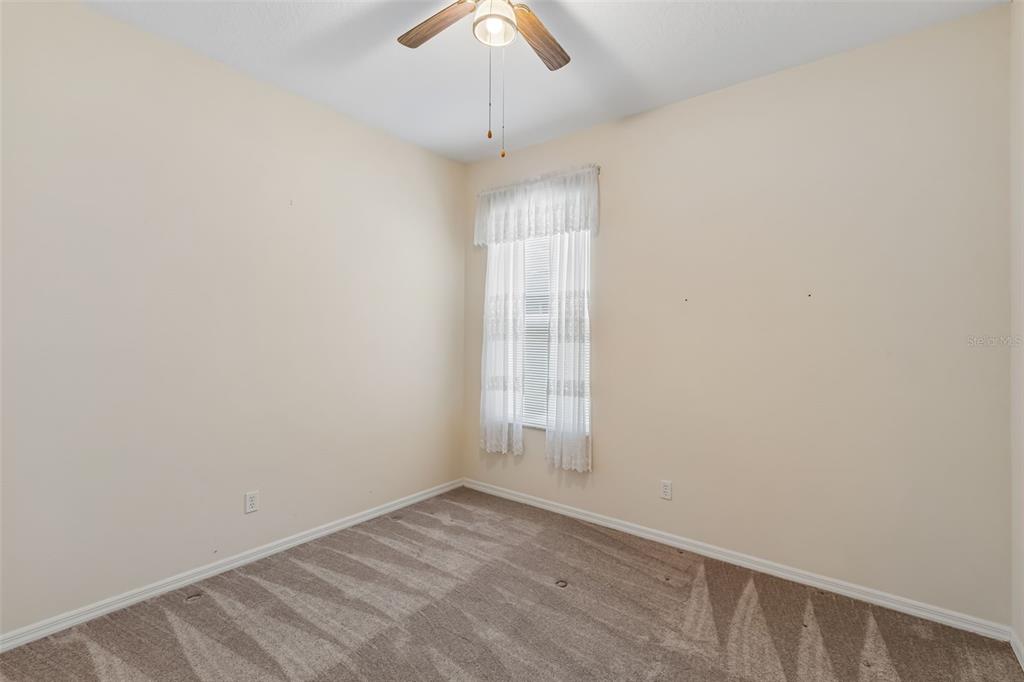 10118 Shortwood Lane Orlando, FL 32836 - Photo 31 of 53 an empty room with a window