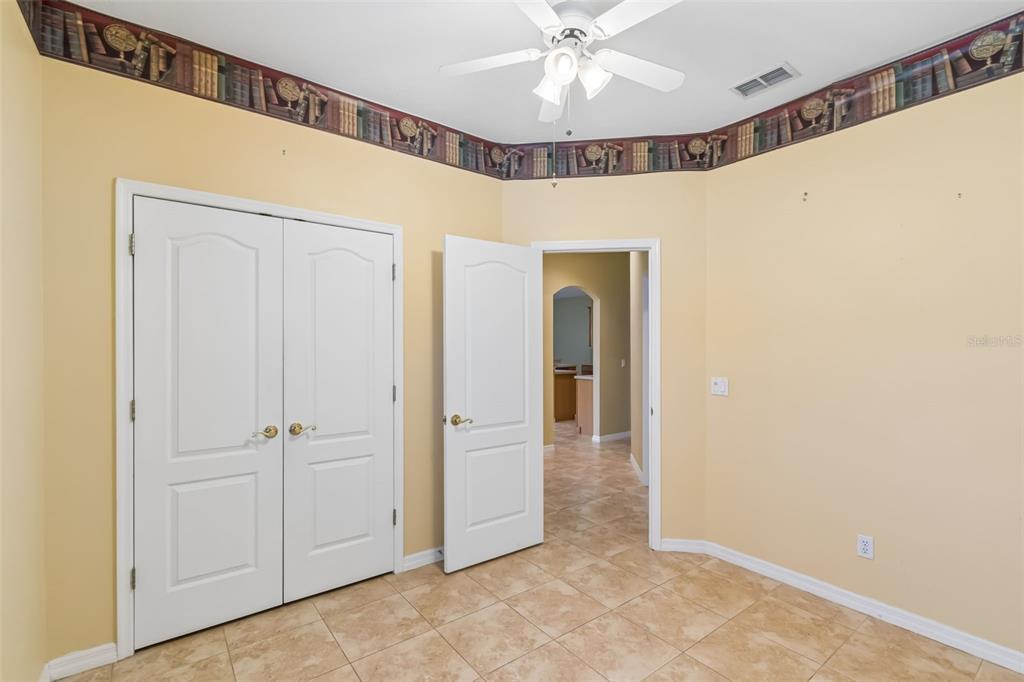 10118 Shortwood Lane Orlando, FL 32836 - Photo 34 of 53 a view of a hallway with closet and a chandelier fan