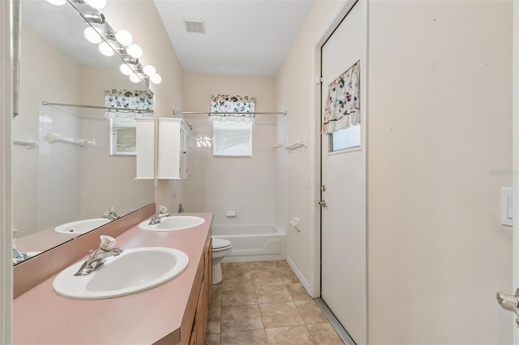 10118 Shortwood Lane Orlando, FL 32836 - Photo 35 of 53 a bathroom with a sink a toilet and shower