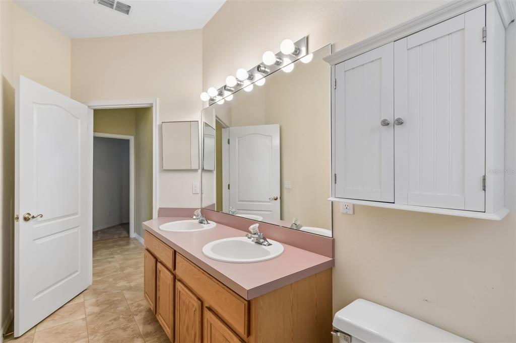 10118 Shortwood Lane Orlando, FL 32836 - Photo 37 of 53 a bathroom with a sink a toilet and shower
