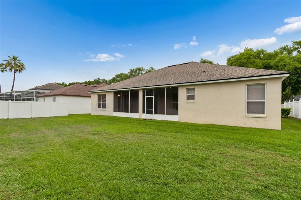 10118 Shortwood Lane Orlando, FL 32836 - Photo 46 of 53 a front view of a house with a garden