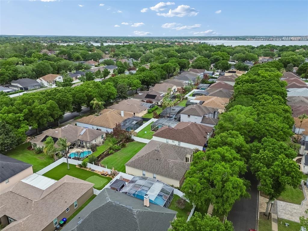 10118 Shortwood Lane Orlando, FL 32836 - Photo 52 of 53 an aerial view of a city with lots of residential buildings green landscape and ocean view