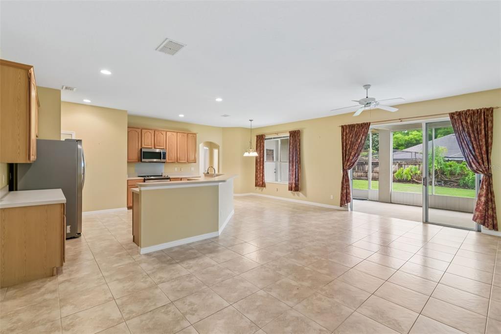 10118 Shortwood Lane Orlando, FL 32836 - Photo 6 of 53 a view of a kitchen with furniture and an empty room