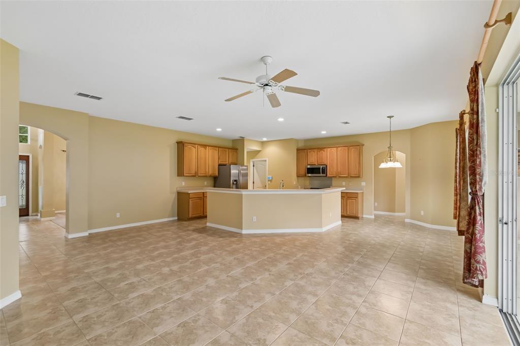 10118 Shortwood Lane Orlando, FL 32836 - Photo 8 of 53 a view of a kitchen with a sink and a refrigerator