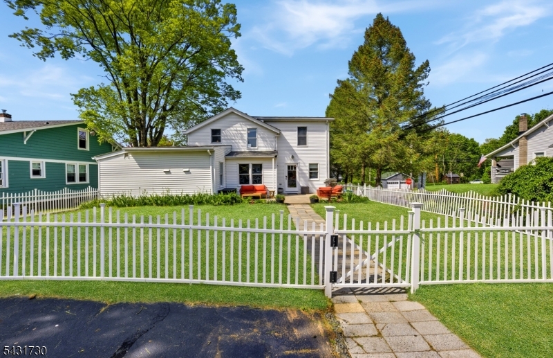 105 Main Street Lebanon, NJ 08833 - Photo 24 of 25 a front view of a house with a garden