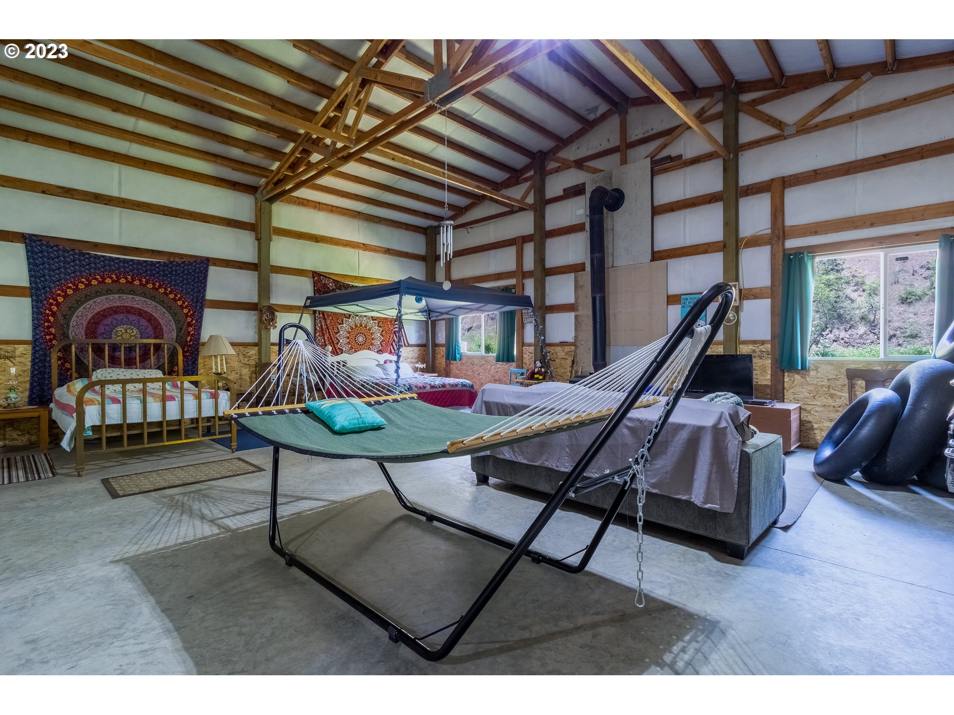 61174 Mill Creek Road Milton Freewater, OR 97862 - Photo 12 of 25 a bedroom with furniture and a wooden floor