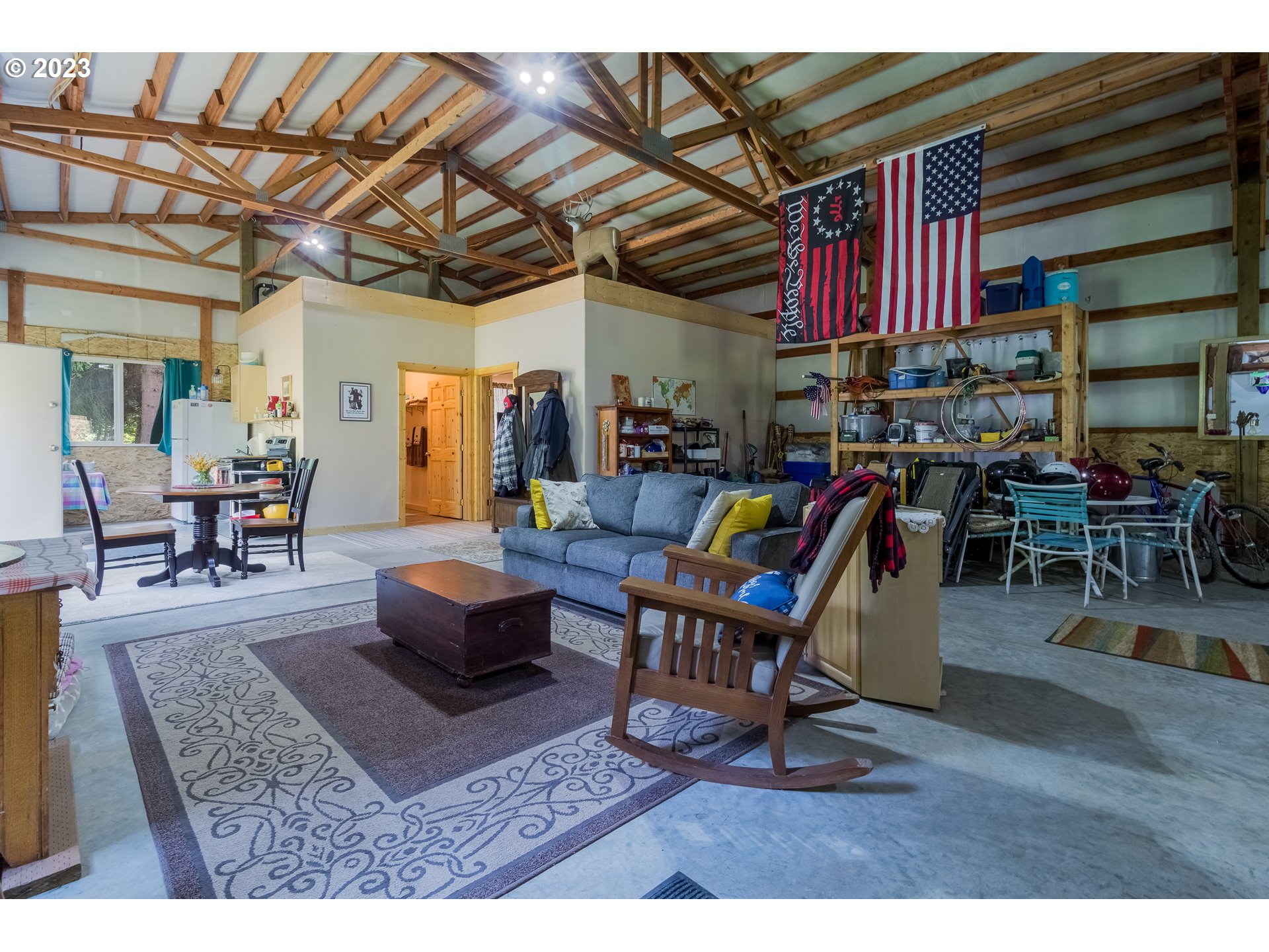 61174 Mill Creek Road Milton Freewater, OR 97862 - Photo 14 of 25 a living room with lots of furniture and a dining table with wooden floor